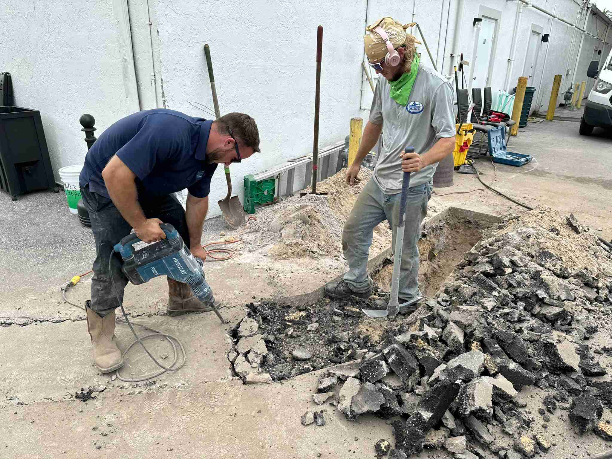 Technicians breaking out a slab for a commercial repair
