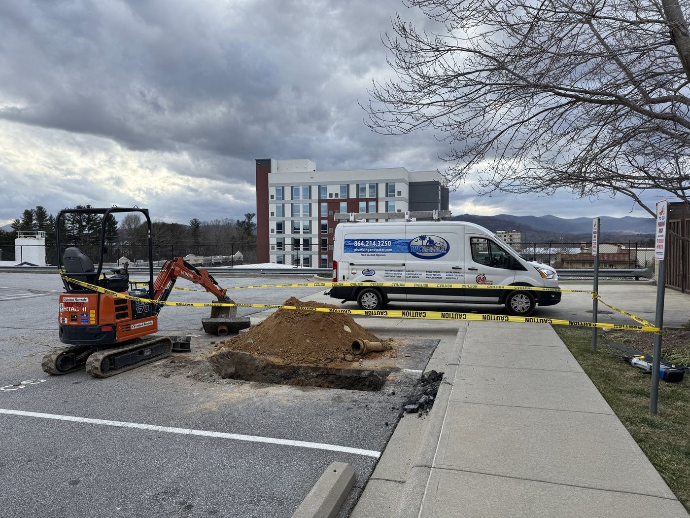 Commercial water line excavation with mini excavator