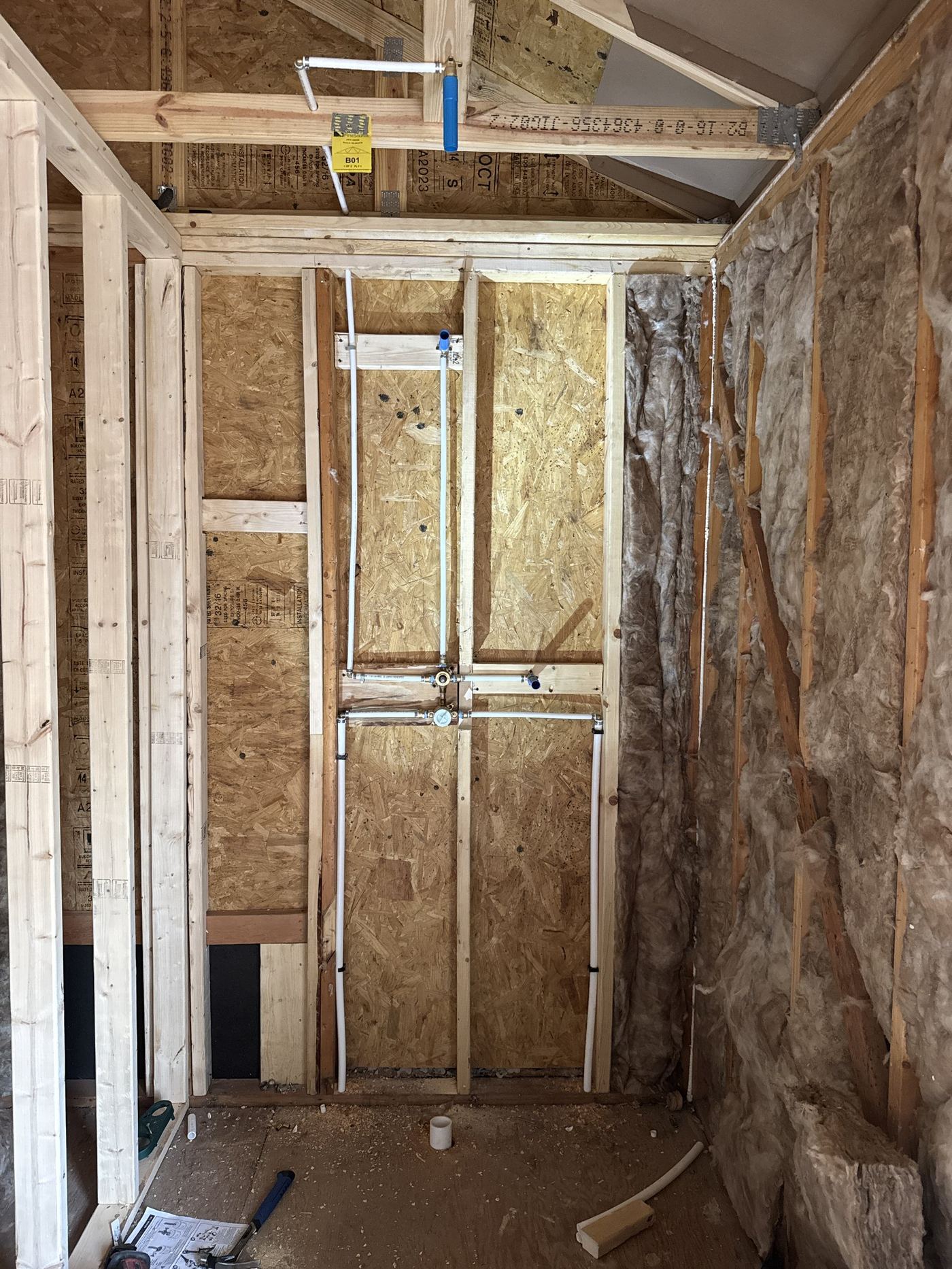 Framed wet wall rough-in during a plumbing remodel